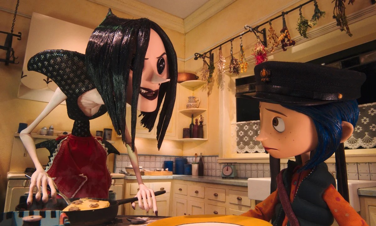 The Other Mother, with black button eyes, leaning over Coraline in a yellow kitchen in Coraline.