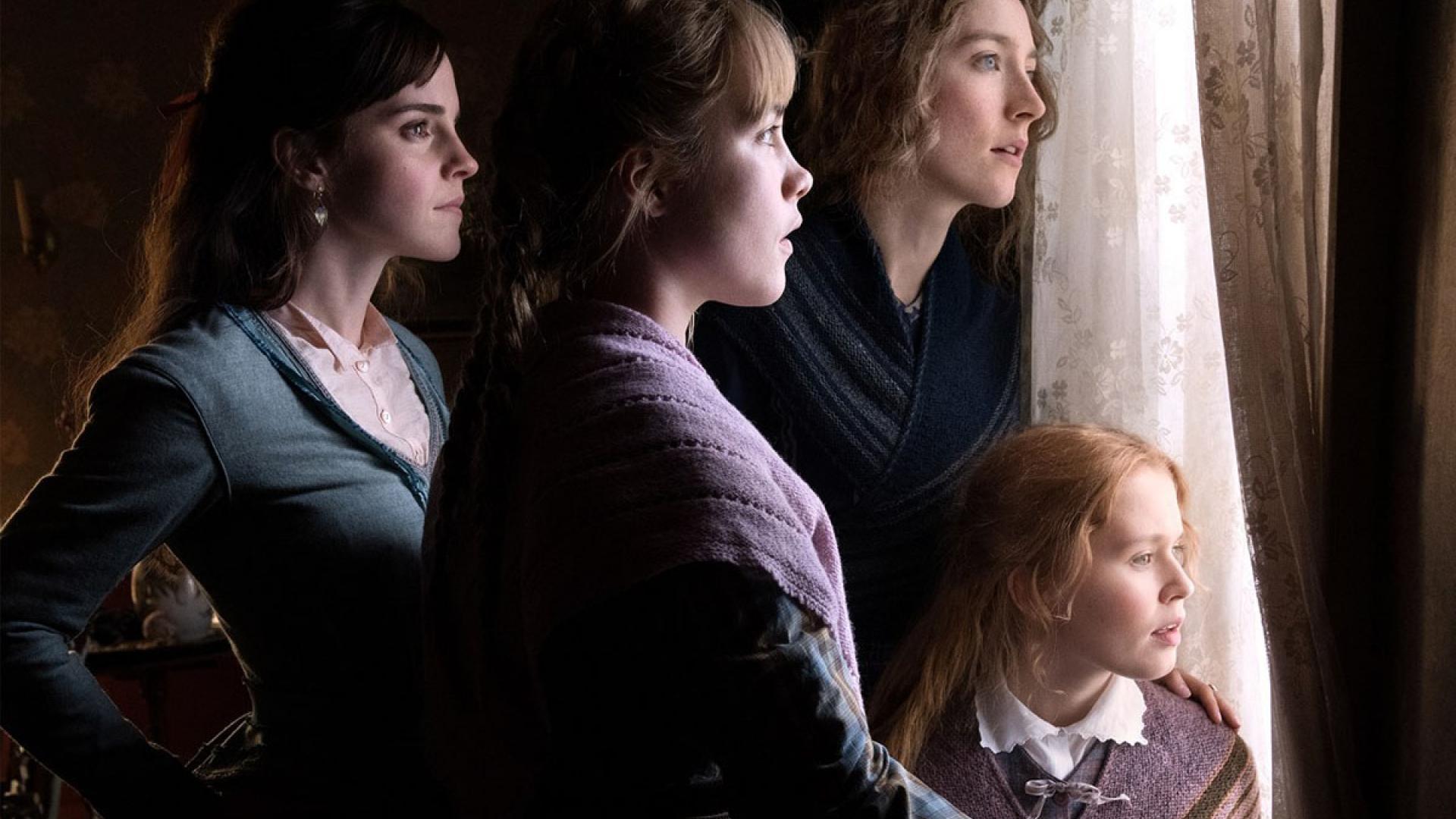 Emma Watson, Florence Pugh, Saoirse Ronan and Eliza Scanlen as the March sisters, looking out of a window together in Little Women (2019).